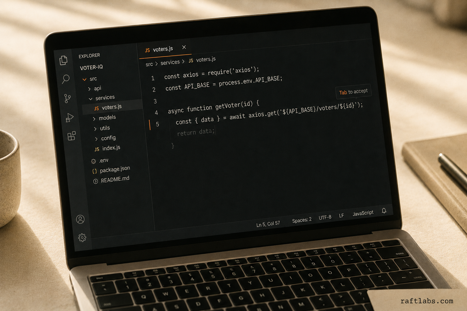 Laptop screen showing an inline AI code completion suggestion appearing after the cursor in a code editor